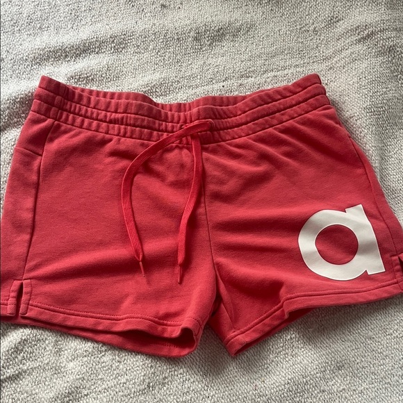 adidas Women's Athletic Shorts in Coral with White Logo - Picture 1 of 8